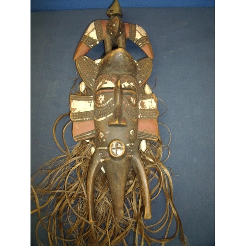 65 - 19/20th C carved wood tribal face mask with traces of painted detail, additional hair and shell work... 