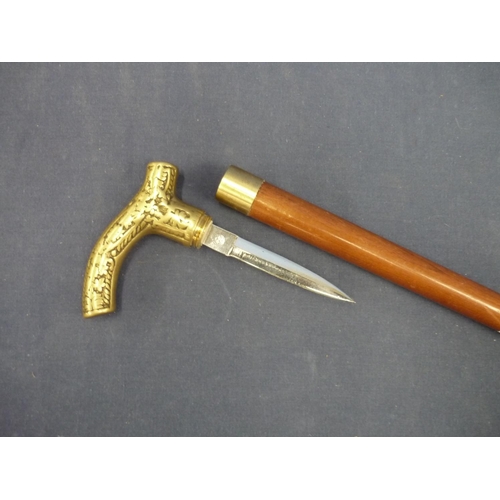 35 - Walking stick with brass handle and screw out dagger with 4 inch double edge blade