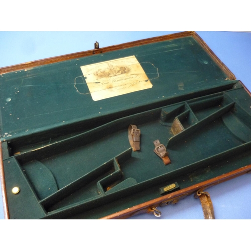 245 - Canvas and leather bound double gun case with outer tooled leather panel for Capt. V. M. Price Argyl... 