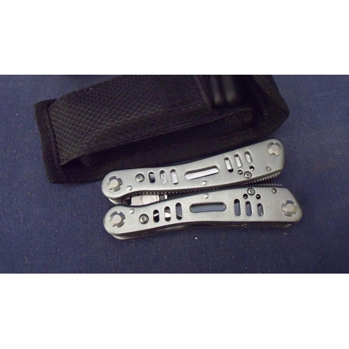 197 - Boxed as new multi-tool with belt pouch