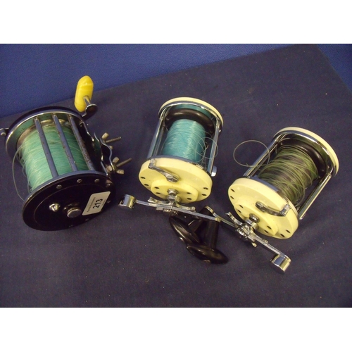 213 - Three beach casting reels including two Mitchell 600's and a Penn Long Beach 68 (3)