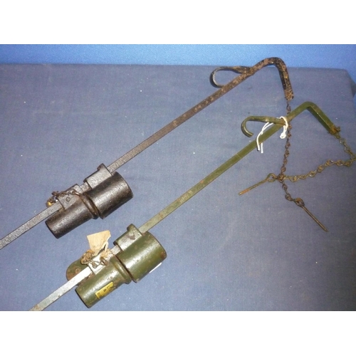 289 - Two vintage poacher alarms mounted on fixing spikes