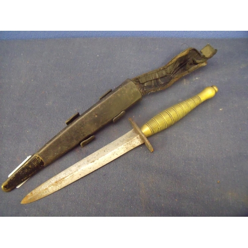 4 - Unusual Fairburn-Sykes style commando knife with 6 1/4 inch double edged blade, steel crosspiece and... 