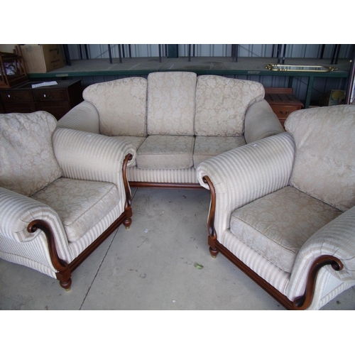 374 - Three piece suite comprising of a three seat low backed sofa with mahogany style frame in regency st... 