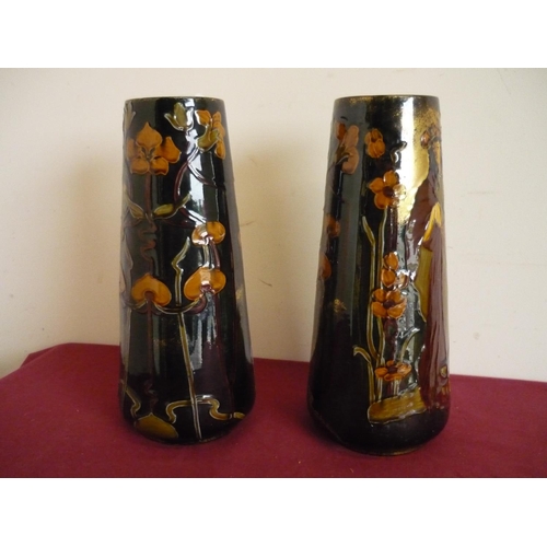 4 - Pair of Art Nouveau ceramic vases of tapering form, depicting semi clad ladies (height 37cm)