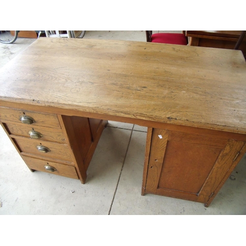 293 - Pine twin pedestal desk with four drawers to one pedestal and cupboard door to the other (width 137c... 