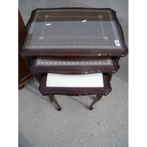 292 - Nest of three mahogany occasional tables with leather and glass inset tops