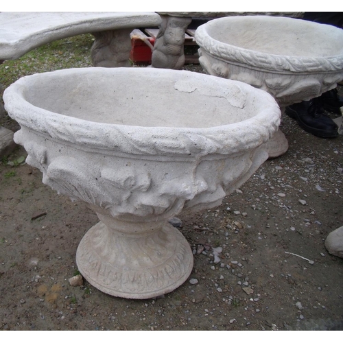 128 - Two large urns decorated with acanthus leaves
