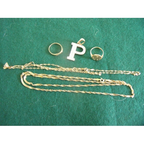 11 - Two 9ct gold chains, 9ct gold Poseidon ring, a 9ct gold love ring and a 9ct gold & faux diamond 'P' ... 