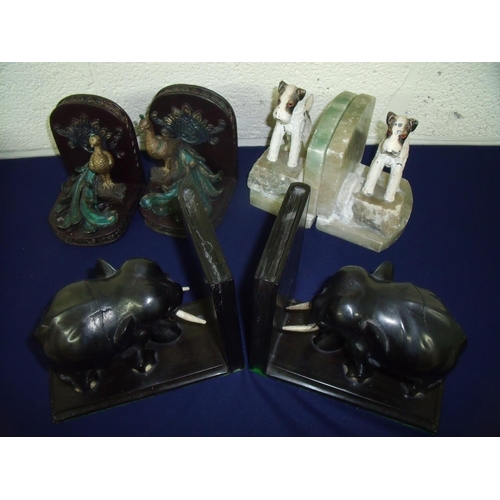 23 - Pair of early 20th C onyx bookends mounted with spelter figures of fox terriers, a pair of elephant ... 