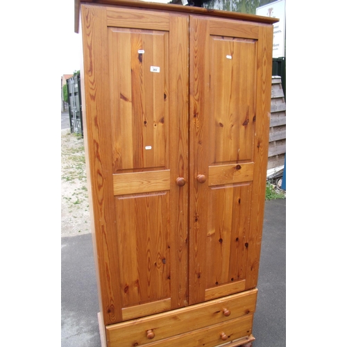 283 - Modern pine double door wardrobe with two drawers to the base (width 90cm)