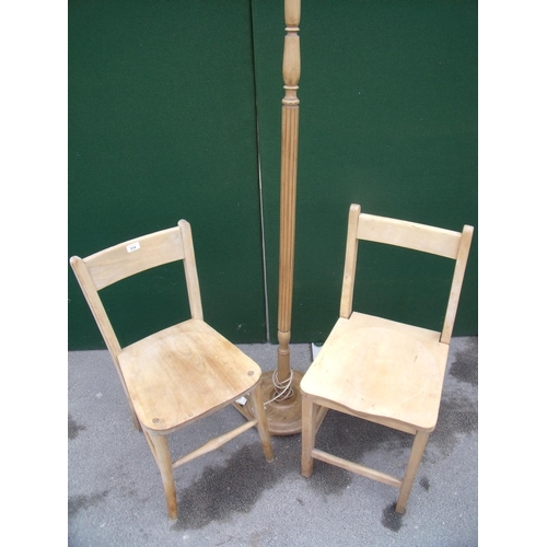 314 - Two beech kitchen chairs and a stripped beech standard lamp