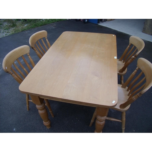 340 - Pine kitchen table and a set of four spindle back farmhouse chairs