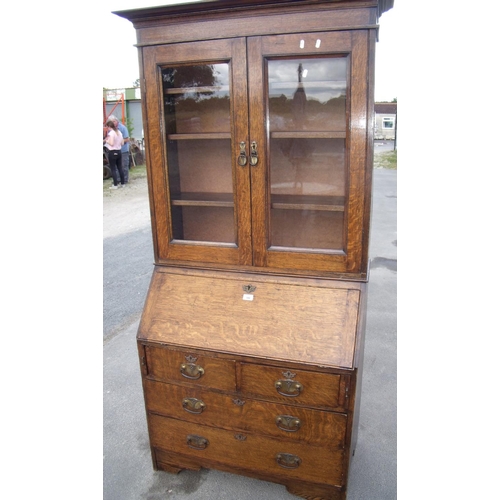 344 - Early 20th C oak bureau bookcase with three adjustable shelves enclosed by glazed panels doors over ... 