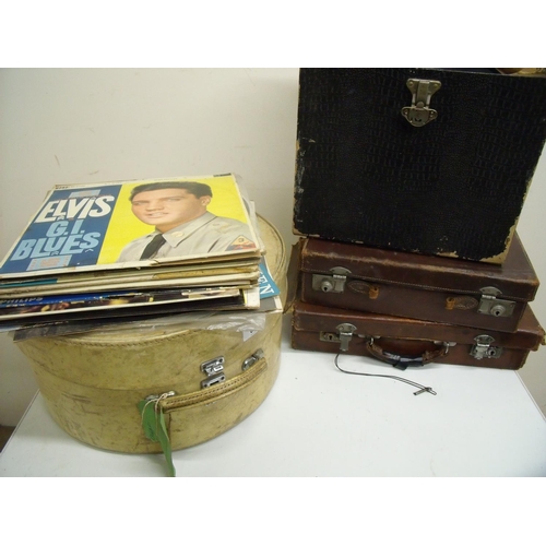 64 - Vintage pig skin vellum hatbox, large selection of records and two vintage brown leather suitcases