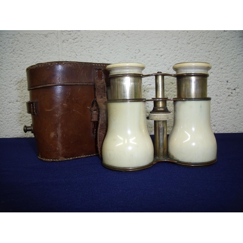 66 - 19th/20th C leather cased pair of ivory bound binoculars