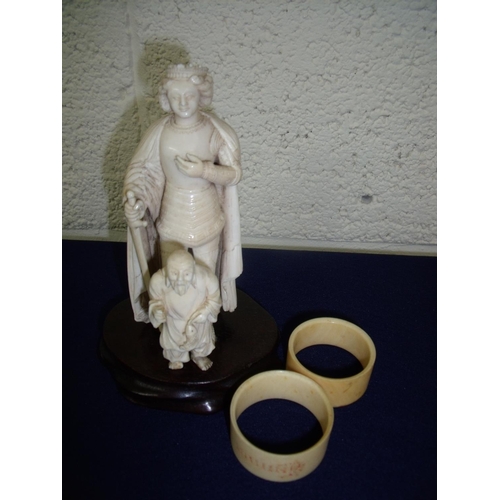 67 - 19th C carved ivory figure of a king (14.5cm high), another Netsuke type figure and two napkin rings