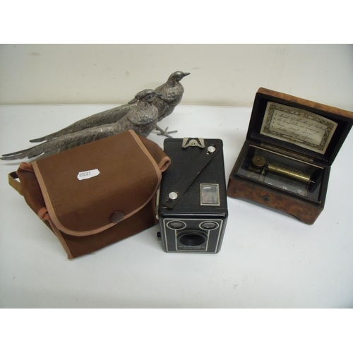 89 - Burr walnut cased musical box (A/F), pair of silver plated pheasants and a cased Brownie D camera