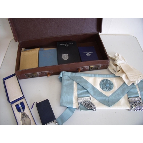 94 - Brown leather Masonic case with contents including aprons, various Masonic booklets, tokens etc