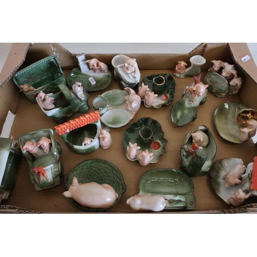 27 - Box containing a large selection of unusual ceramic pig figures