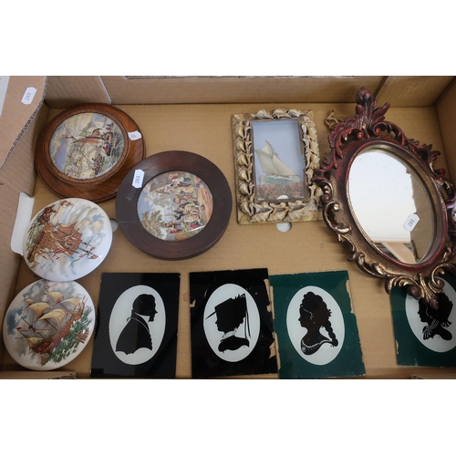 28 - Selection of glass silhouettes, a gilt framed mirror, pot lids etc