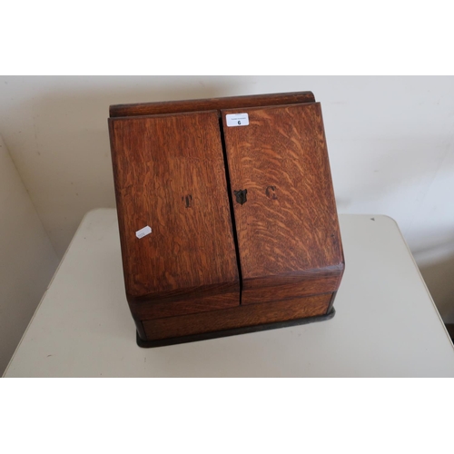 6 - Edwardian oak secretaire table box with two folding doors, lift up top compartment and fitted interi... 