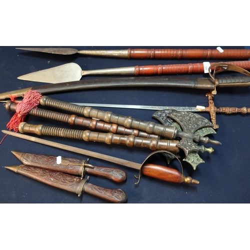 65 - Large selection of various assorted reproduction weapons including hand axes, hand spears, 20th C In... 