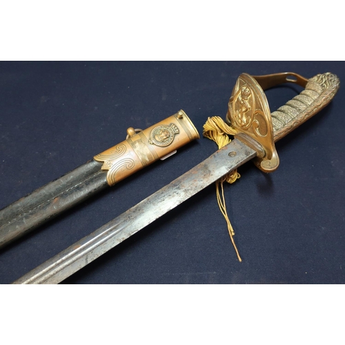 67 - British Royal Navy Officers Sword with 30 1/2inch double fullered blade with engraved and etched det... 