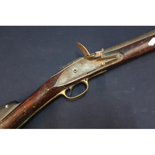 96 - 19th C flintlock carbine with 18 inch large bore barrel with fixed foresight, brass butt plate, trig... 