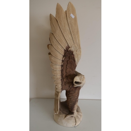 22 - Large carved wood figure of an eagle with wings outstretched (approx. 80cm high)