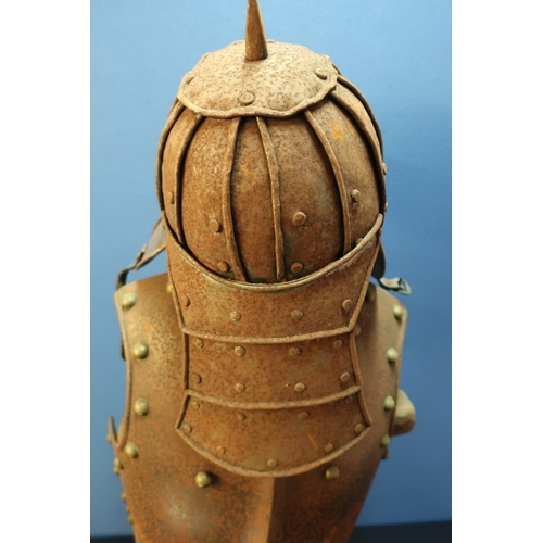 40 - Reproduction steel riveted breast plate and a lobster tail style helmet, with wooden stand