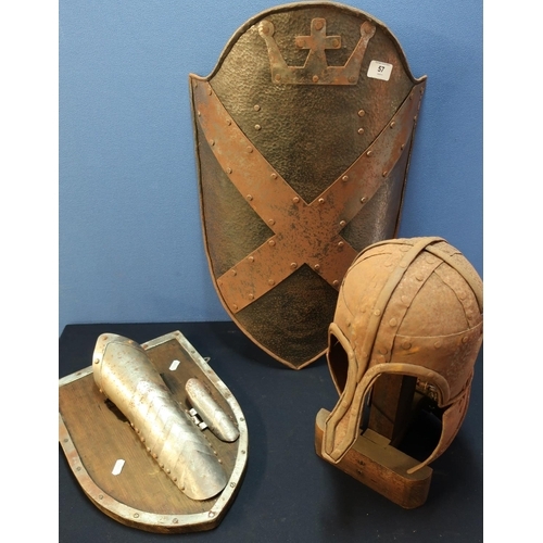 57 - Reproduction steel medieval style crested wall shield, a similar steel helmet with cheek pieces, ext... 