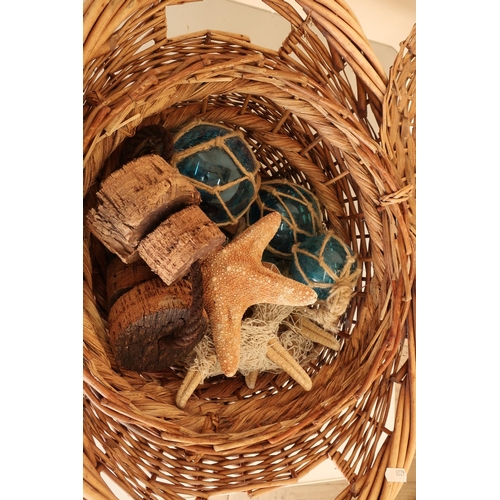 109 - Two wicker baskets containing various starfish shells, glass and cork fishing floats