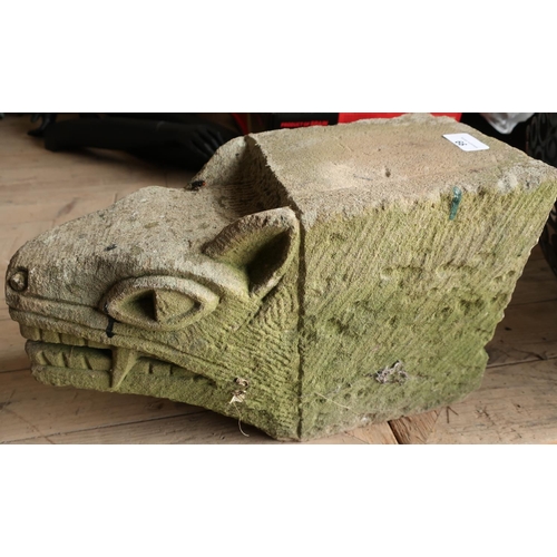 66 - Dressed and carved block of sandstone with gargoyle type head (40cm x 16cm x 24cm)