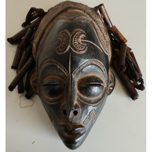 97 - Carved African style tribal face mask with ribbon and beadwork hair