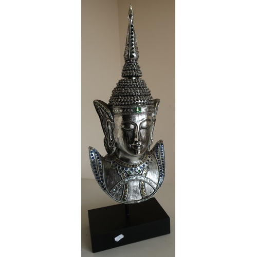 99 - Mounted bust of Thai style deity in silver coloured and sequin finish (height 60cm)