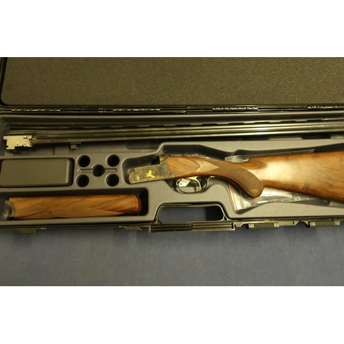 512 - Cased Rottweil 28 bore over and under ejector shotgun with 30 inch barrels, multi chokes, with singl... 