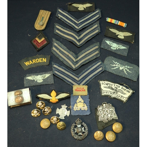 193 - Selection of mostly British military buttons, RAF cloth, uniform badges, cap badges etc