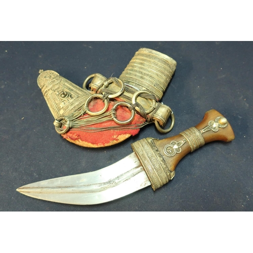 227 - Yemen Jambiya type dagger with 7 inch curved blade, horn grip and white metal overlaid detail, compl... 