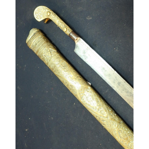 229 - Brass and steel hilted 19th C Yataghan style dagger with 18 inch blade and engraved brass scabbard
