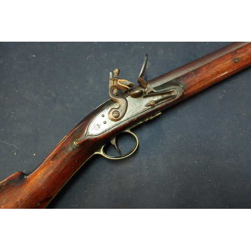 245 - Early 19th C JN. Jones & Co 14 bore flintlock fouling gun with 32 inch barrel, complete with wooden ... 