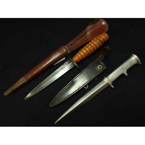 269 - Two British WWII fighting knives including a stainless steel handled knife by Robins Dudley with 6 i... 