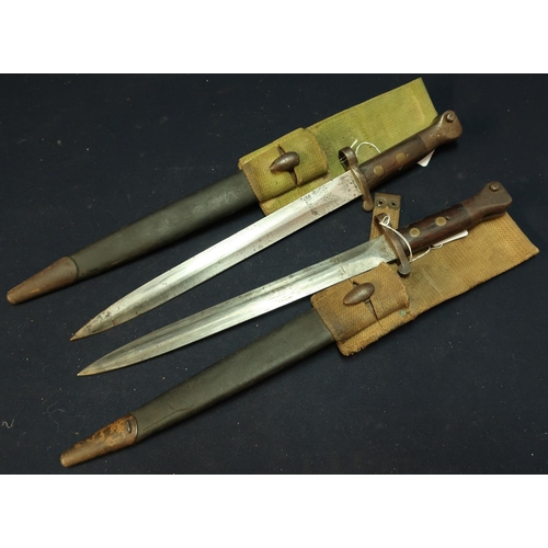 270 - Two British 1888 bayonets complete with leather scabbards and webbing frogs, with various stamped de... 