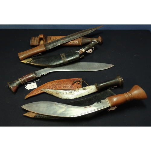 280 - Group of various assorted Eastern daggers including Kukri knives, African style tribal dagger etc