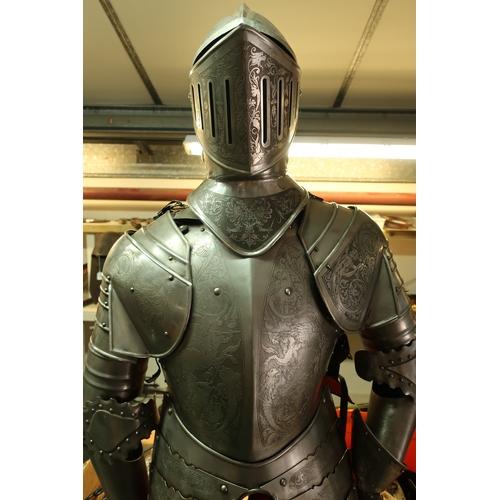 34 - Quality reproduction steel Suit of Armour with fully enclosed visor helmet with engraved detail depi... 