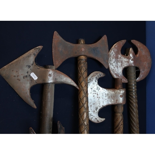 45 - Group of four quality reproduction double handed axes of various forms with wooden shafts, including... 