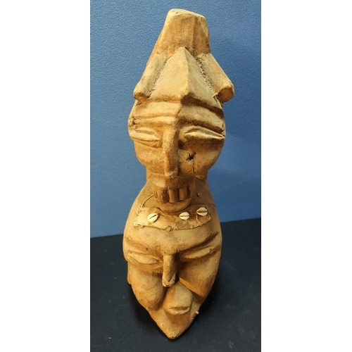 234 - Carved wood African tribal style figure depicting two faces with shell and woven material mounted de... 