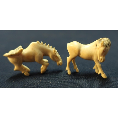 41 - 19th/20th C two small carved Chinese ivory figures of horses (height 3cm)
