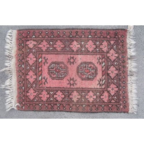 186 - Traditional pattern Islamic prayer rug, brick red ground with two central medallions and geometric b... 