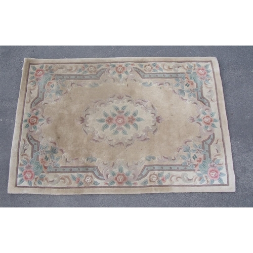 187 - Chinese embossed washed woollen rug, beige ground with central floral medallion and floral pattern b... 